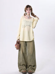 Vintage Faded Wash Blue Wide-Leg Jeans with Patterned Detailing