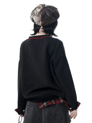 Y2K Black Distressed Sweater with Cross Print & Red Plaid Cuffs
